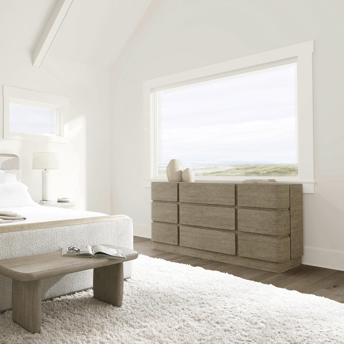 Modern bedroom with a bed, nightstands, and dresser.