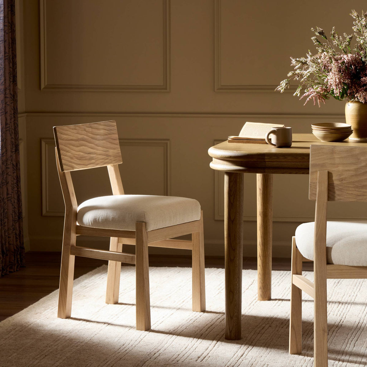 Leward dining chairs around a wood dining table