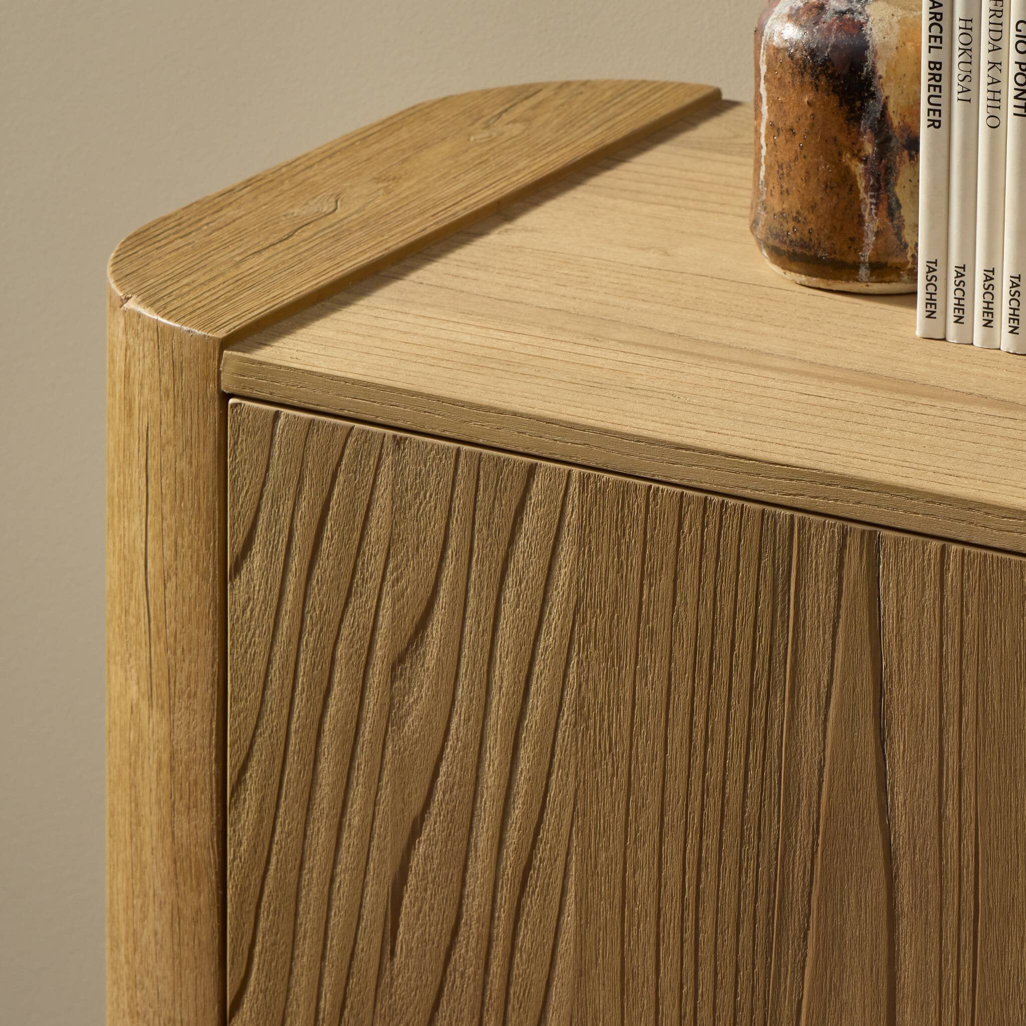 Light brown sungkai wood sideboard with sandblasted grain, rounded corners, and push-latch doors.