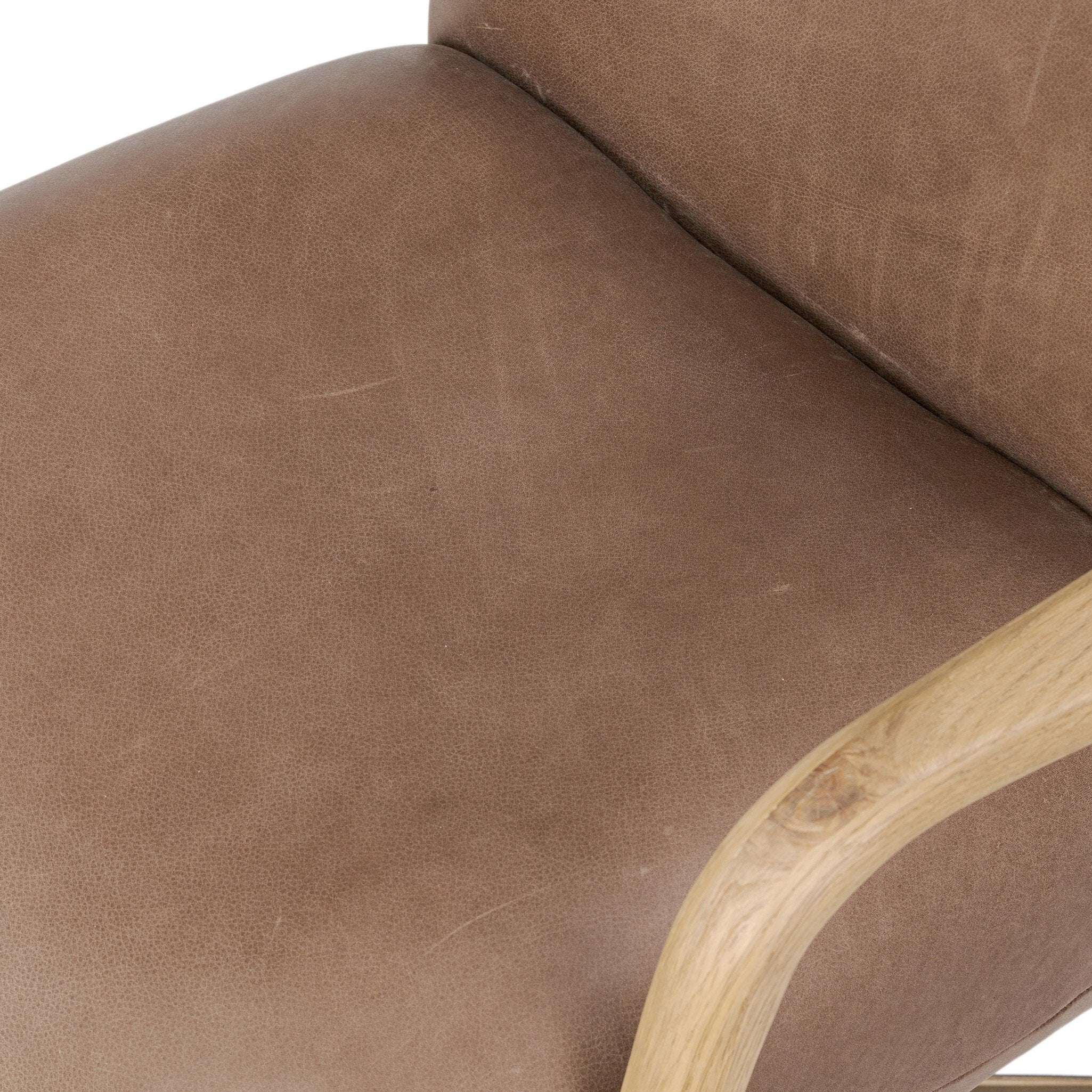 Sammy Desk Chair in top-grain brown leather with thick tufting and stitched seams.