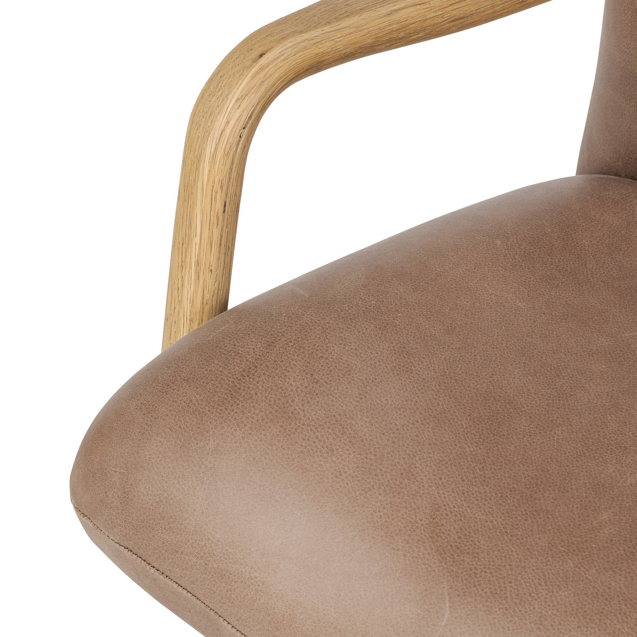 Close-up of Sammy Desk Chair showing curved smoked oak arm and brown leather seat