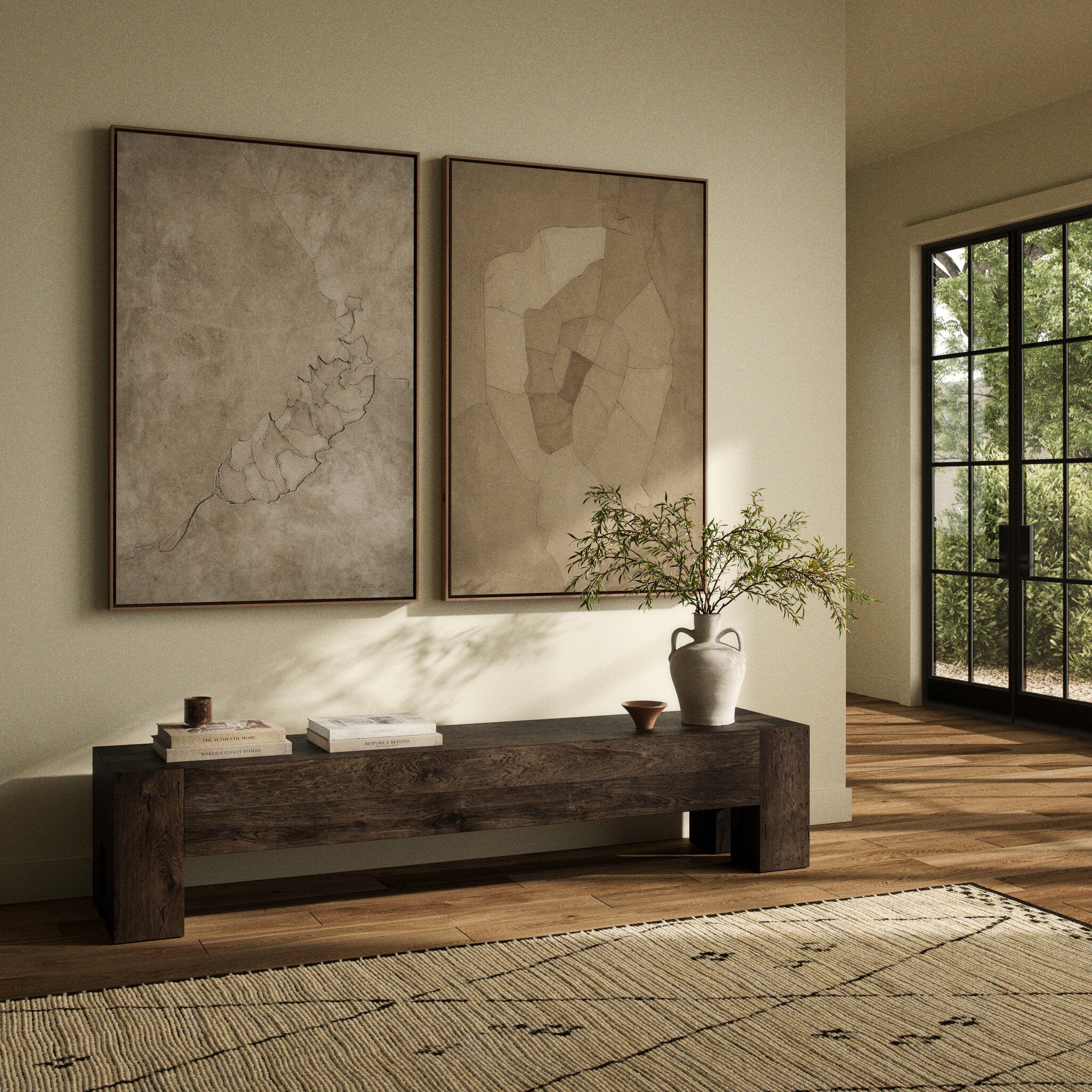 Modern living room with wooden coffee table, decorative items, and abstract wall art.