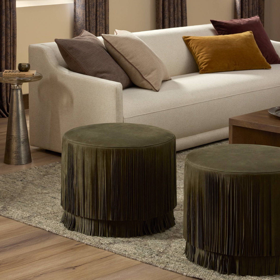 Warm living room with layered seating and a textured rug