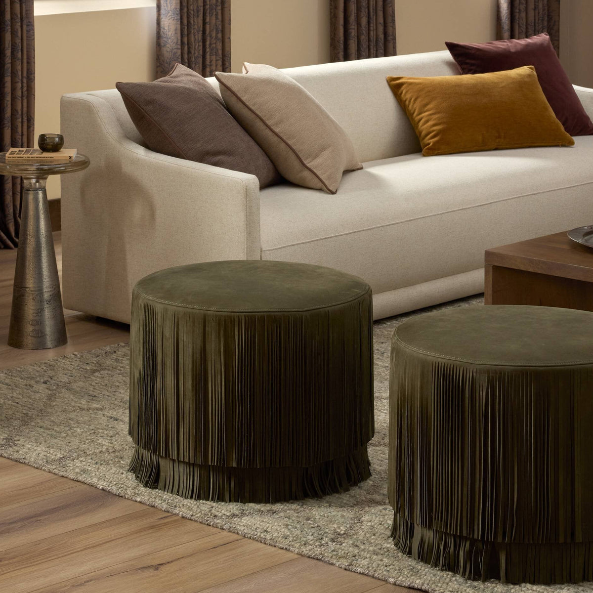 Warm living room with layered seating and textured rug