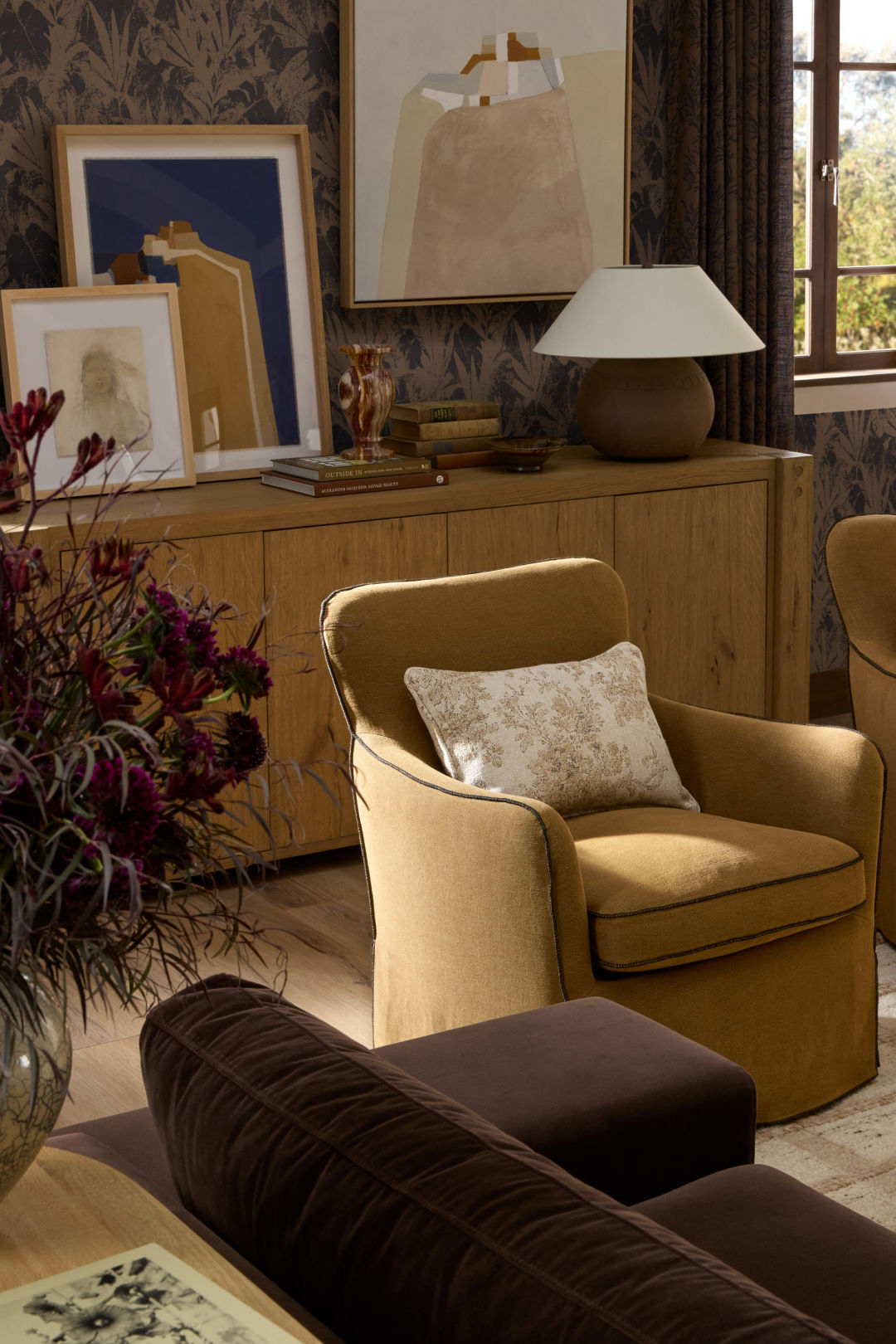 Styled sideboard with artwork, decor, and finishing pieces