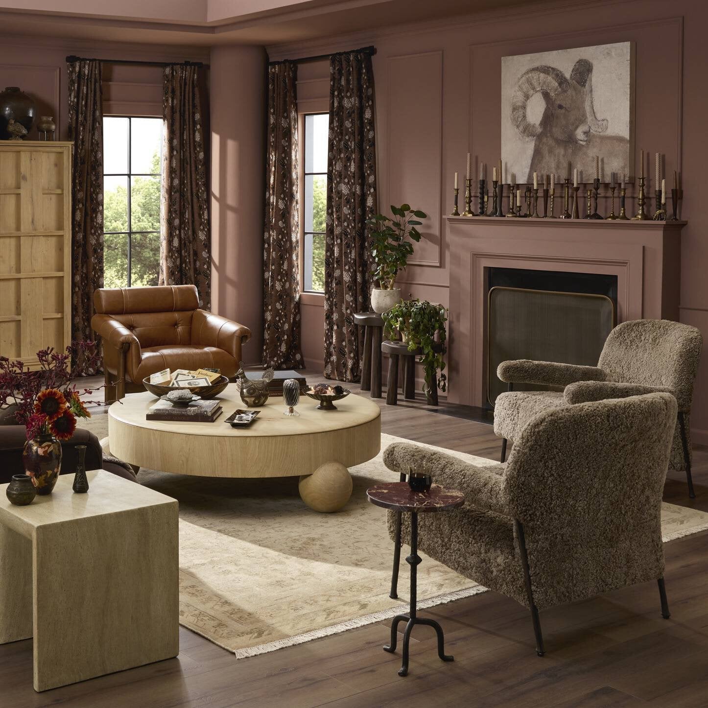 Living room with brown furniture, a round coffee table, and decorative items.