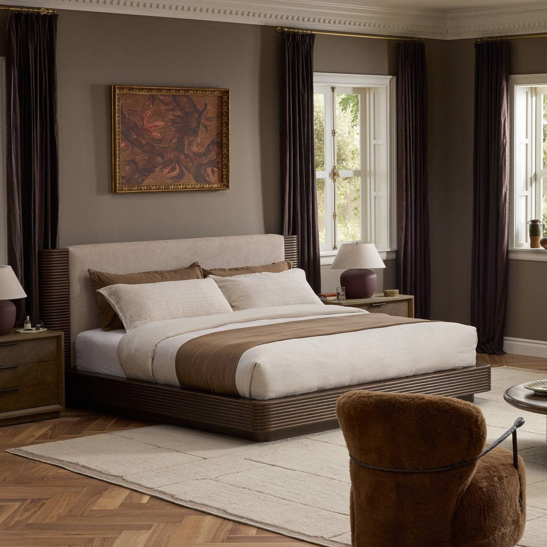 Bedroom furniture and soft textiles in a warm interior