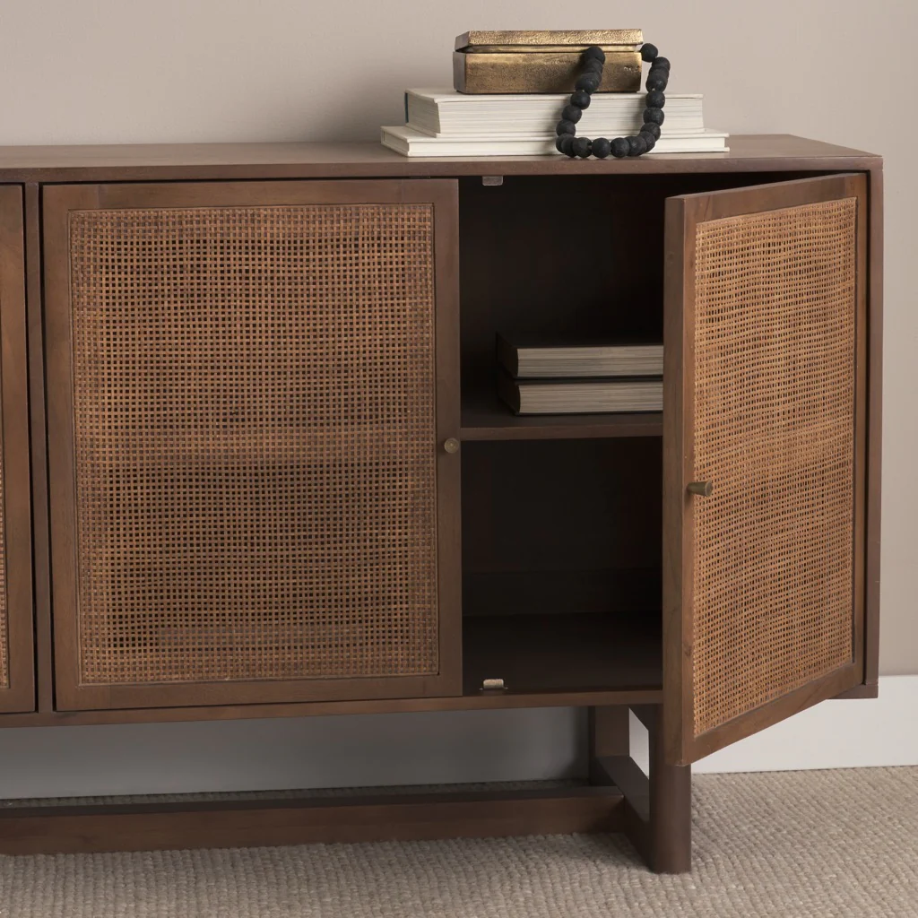 Wooden sideboard with wicker doors against a neutral wall