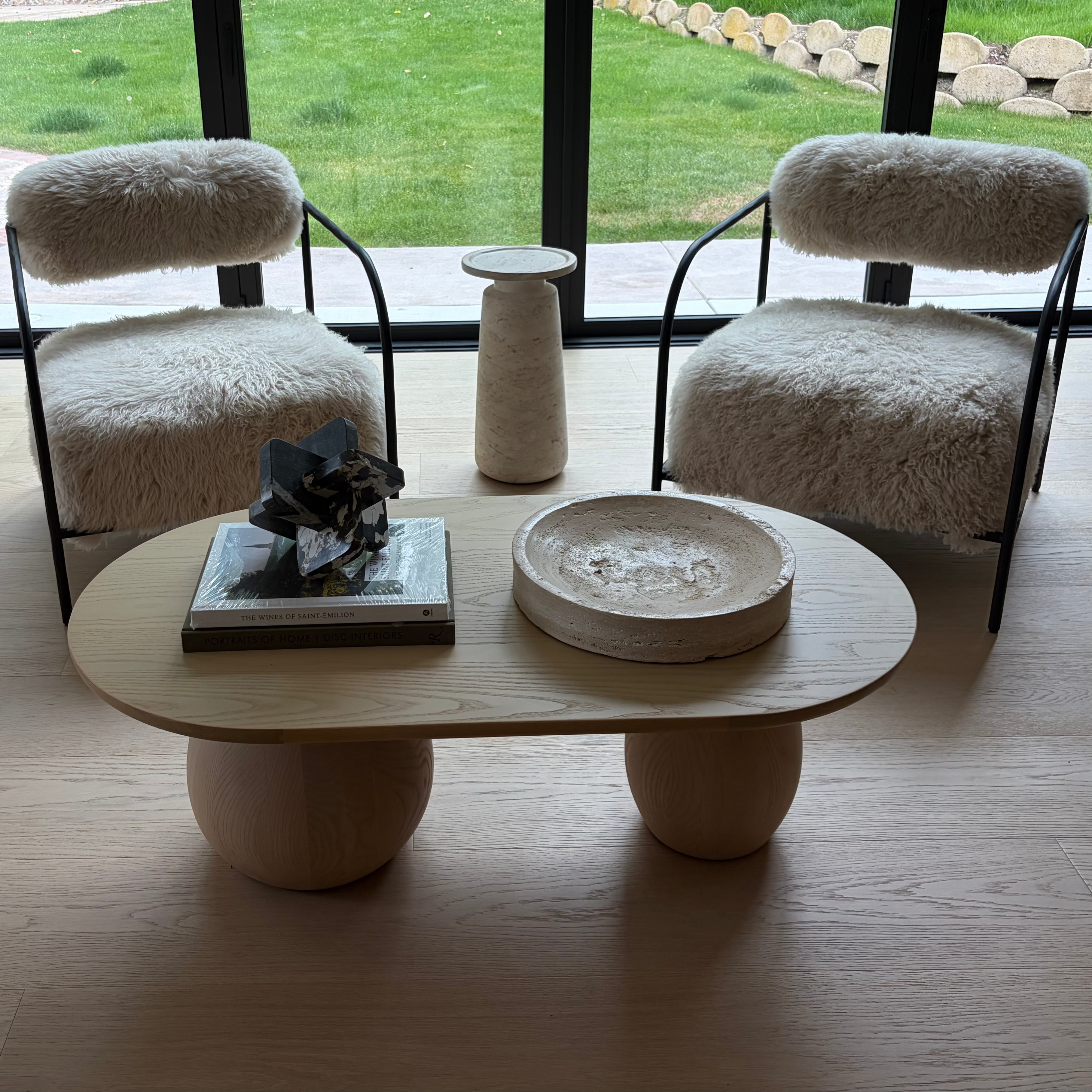 sherpa chairs and wood coffee table