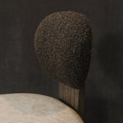Close up of boucle top dining chair 