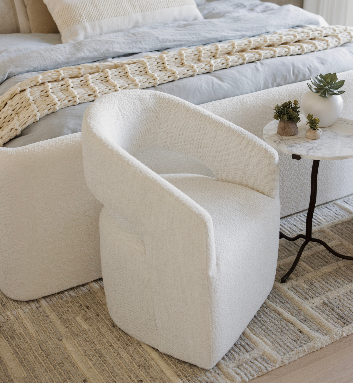 White textured swivel chair in a living room.