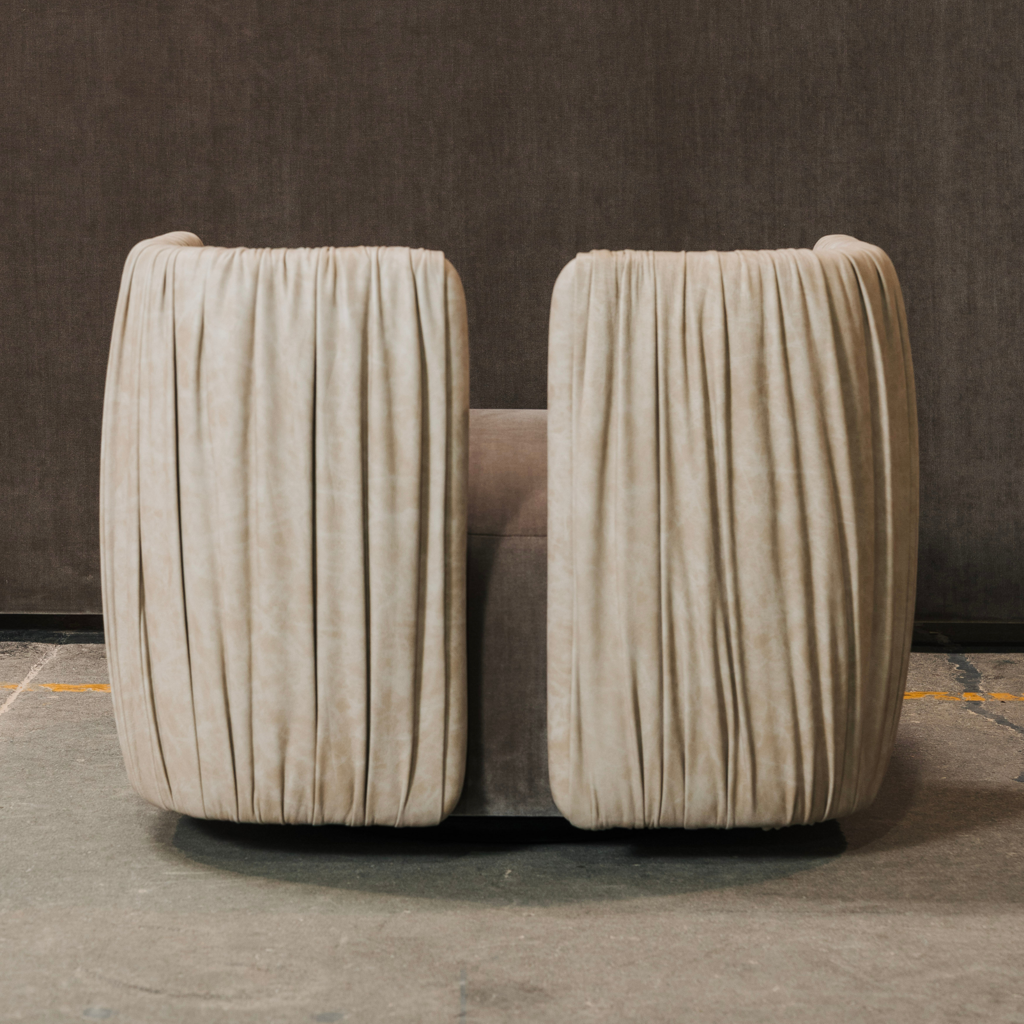 Ruched leather details on designer accent chair.